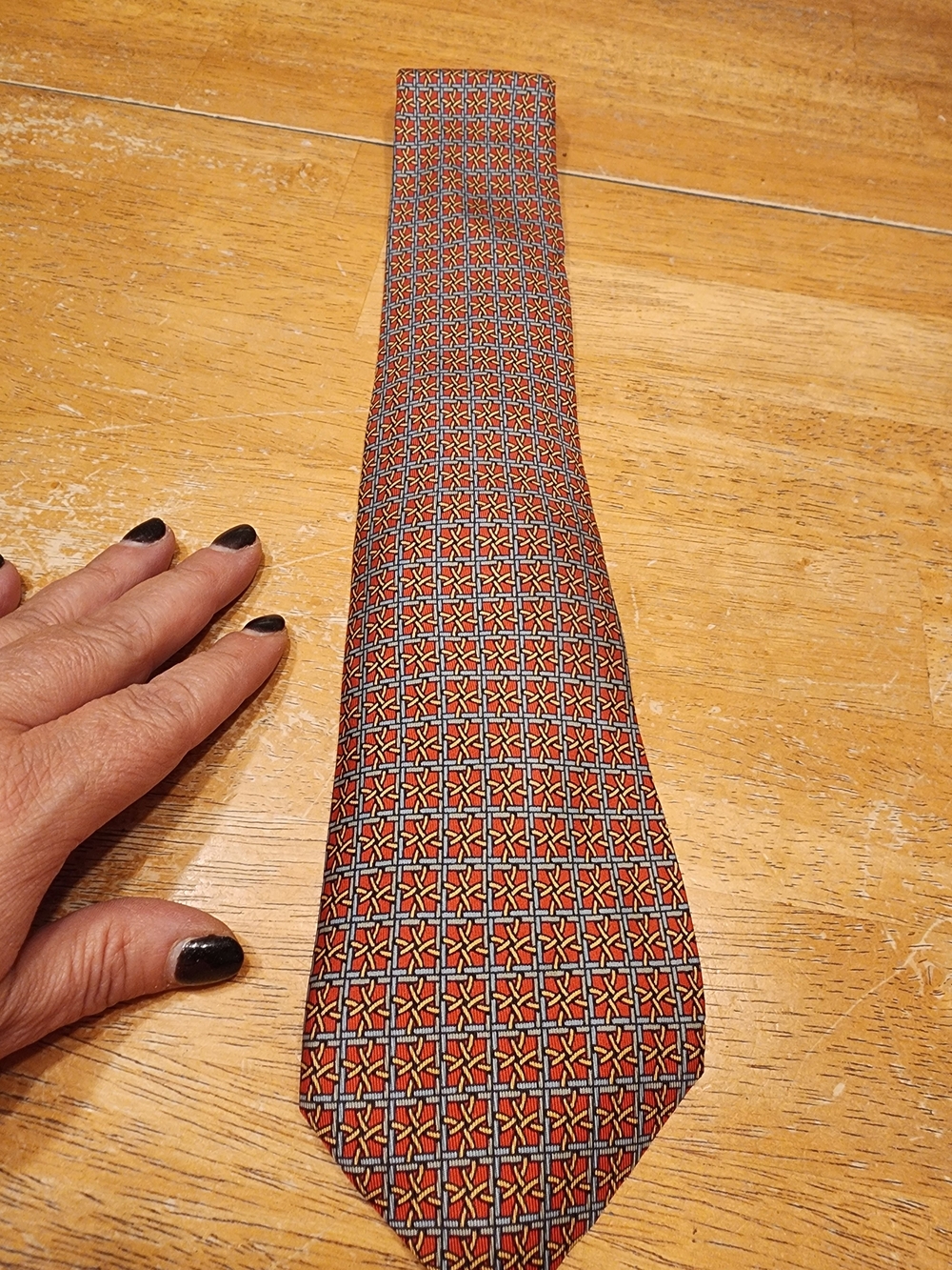 red and blue patterned silk necktie by Hermès Paris